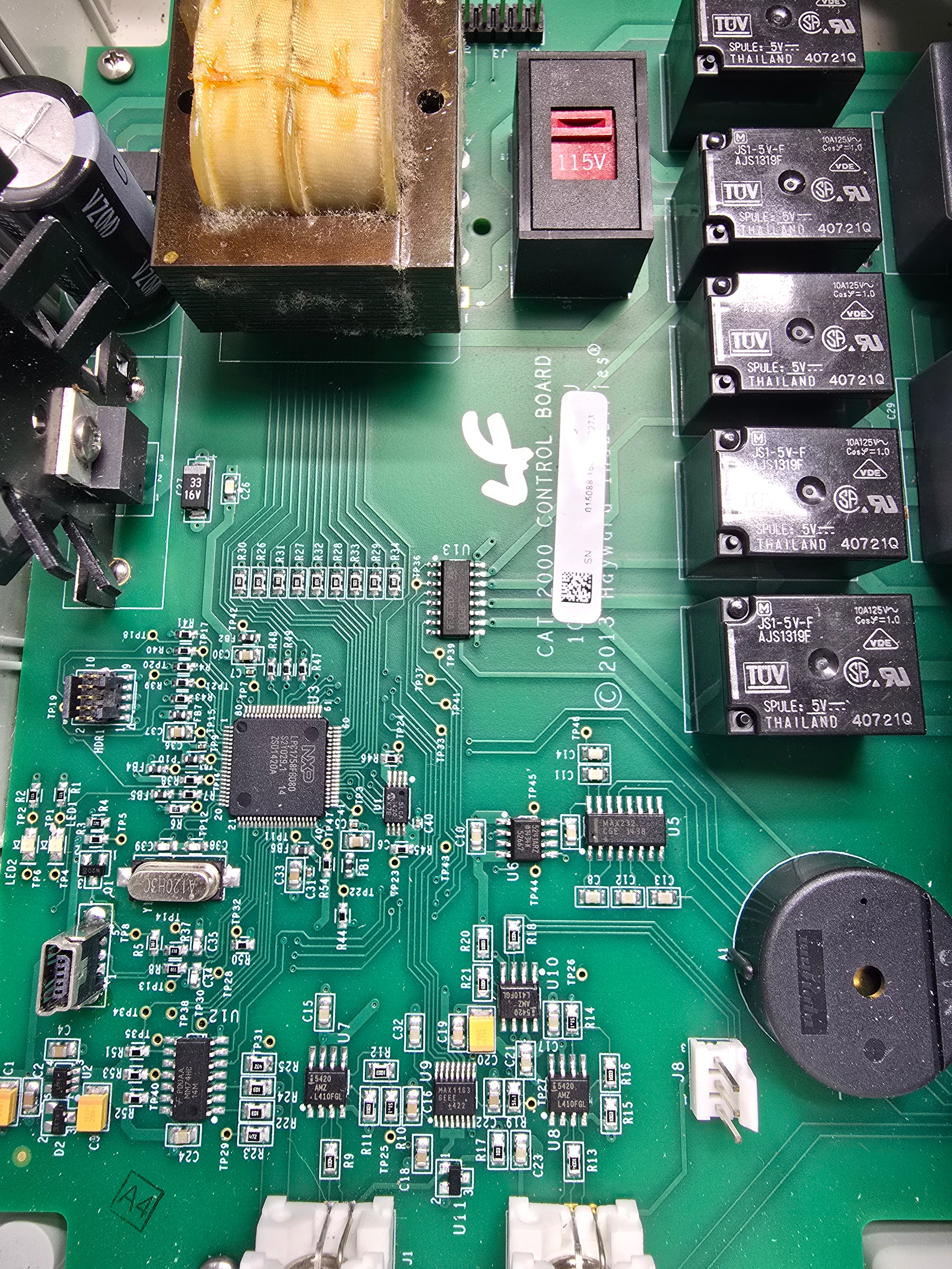 Hayward CAT 2000 internal control board showing NXP processor, relays, transformer, and capacitors — component-level repair expertise