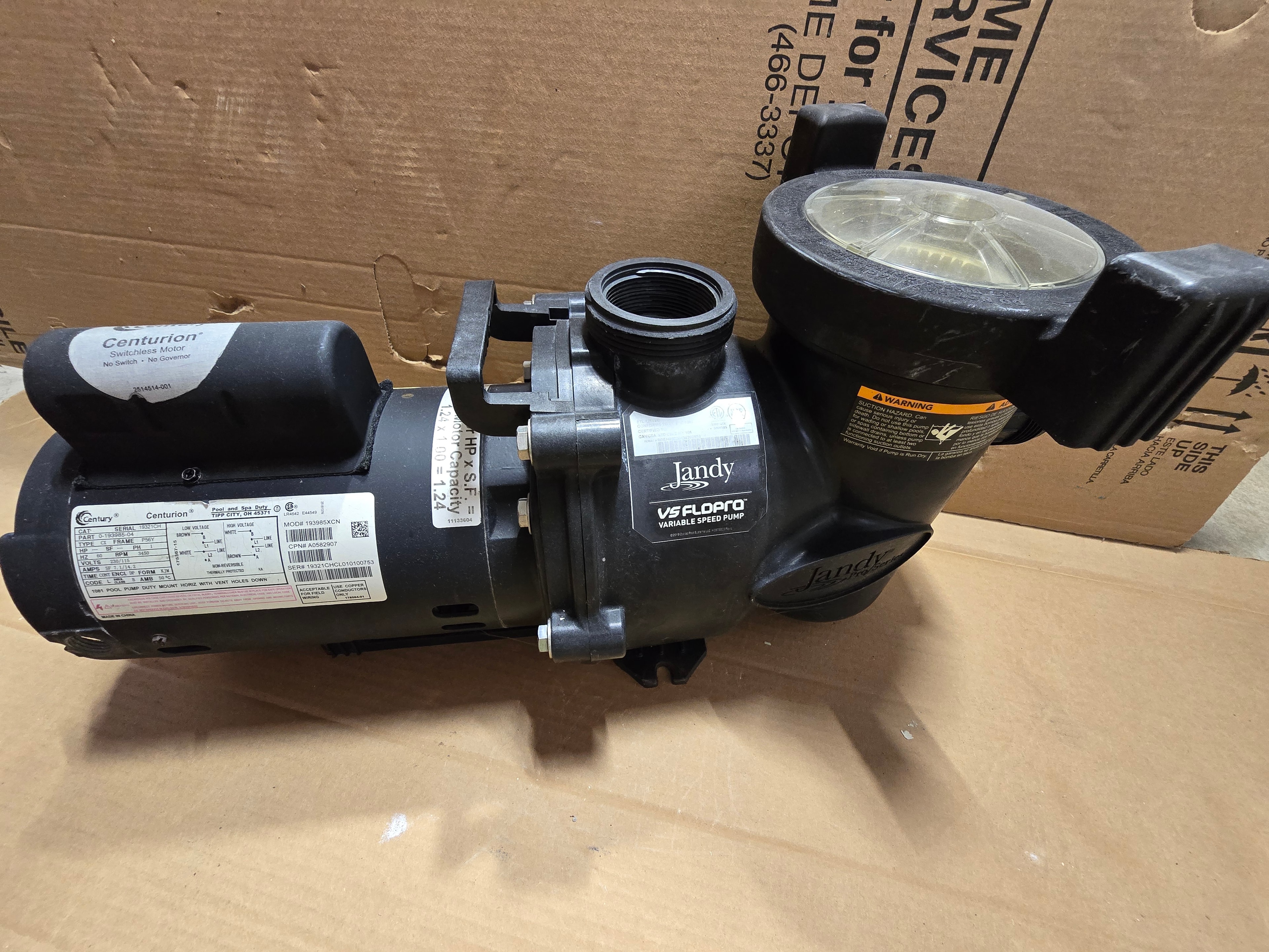 Jandy FloPro pump with lid open showing strainer basket