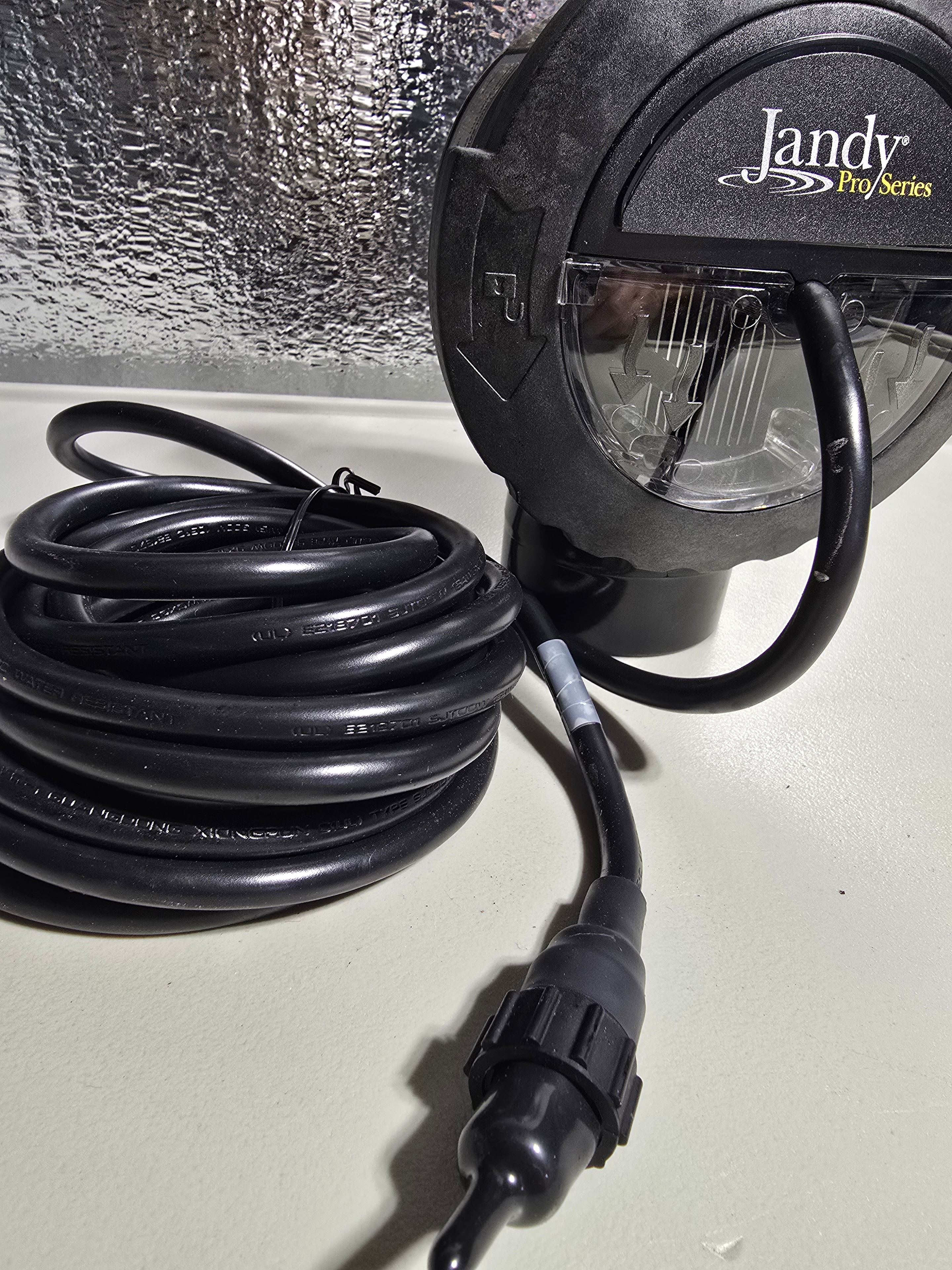 Jandy TruClear 11K housing side view with full cable coil and waterproof connector