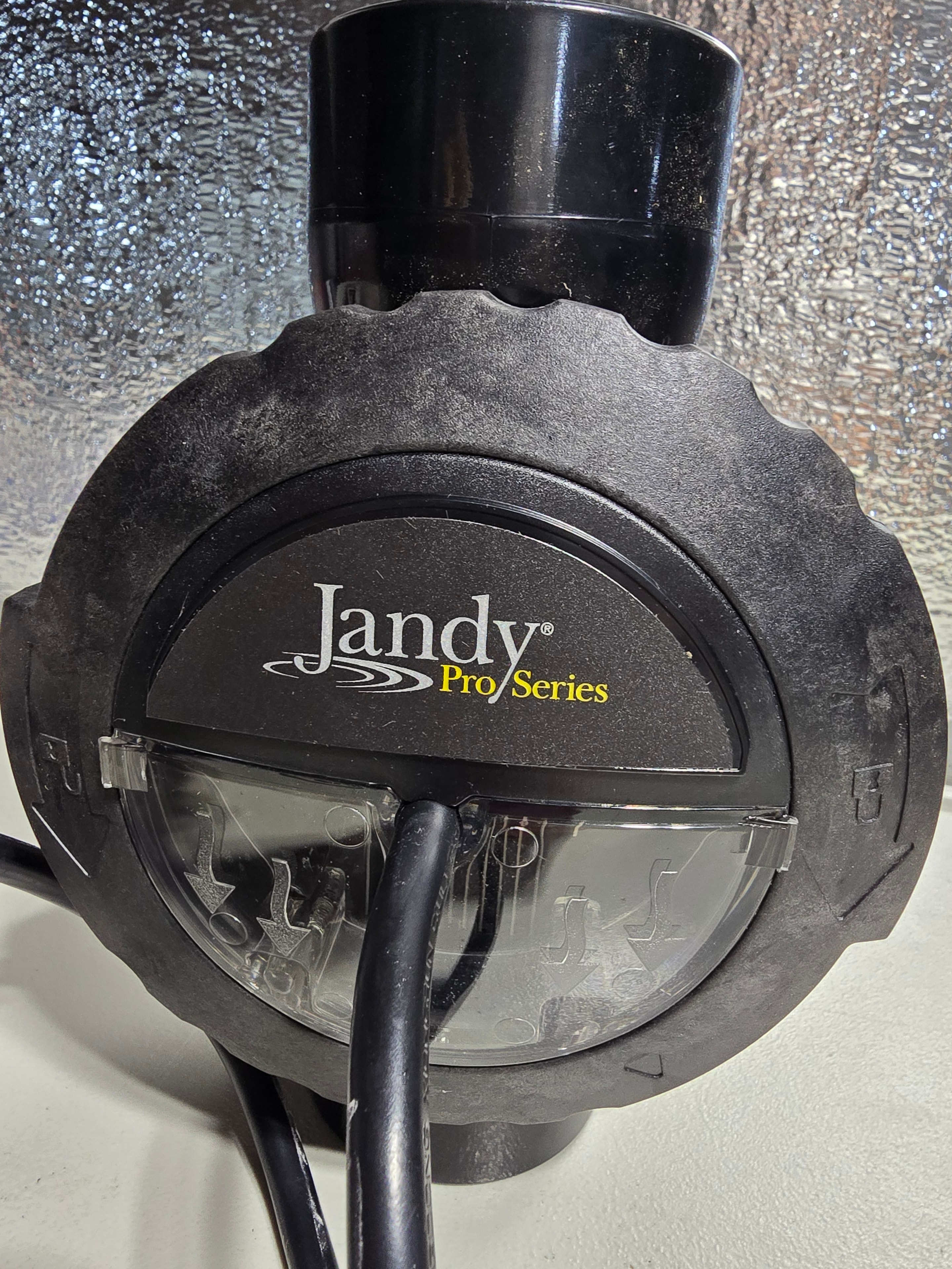 Jandy Pro Series TruClear 11K cell housing front — flow port and cell inserted