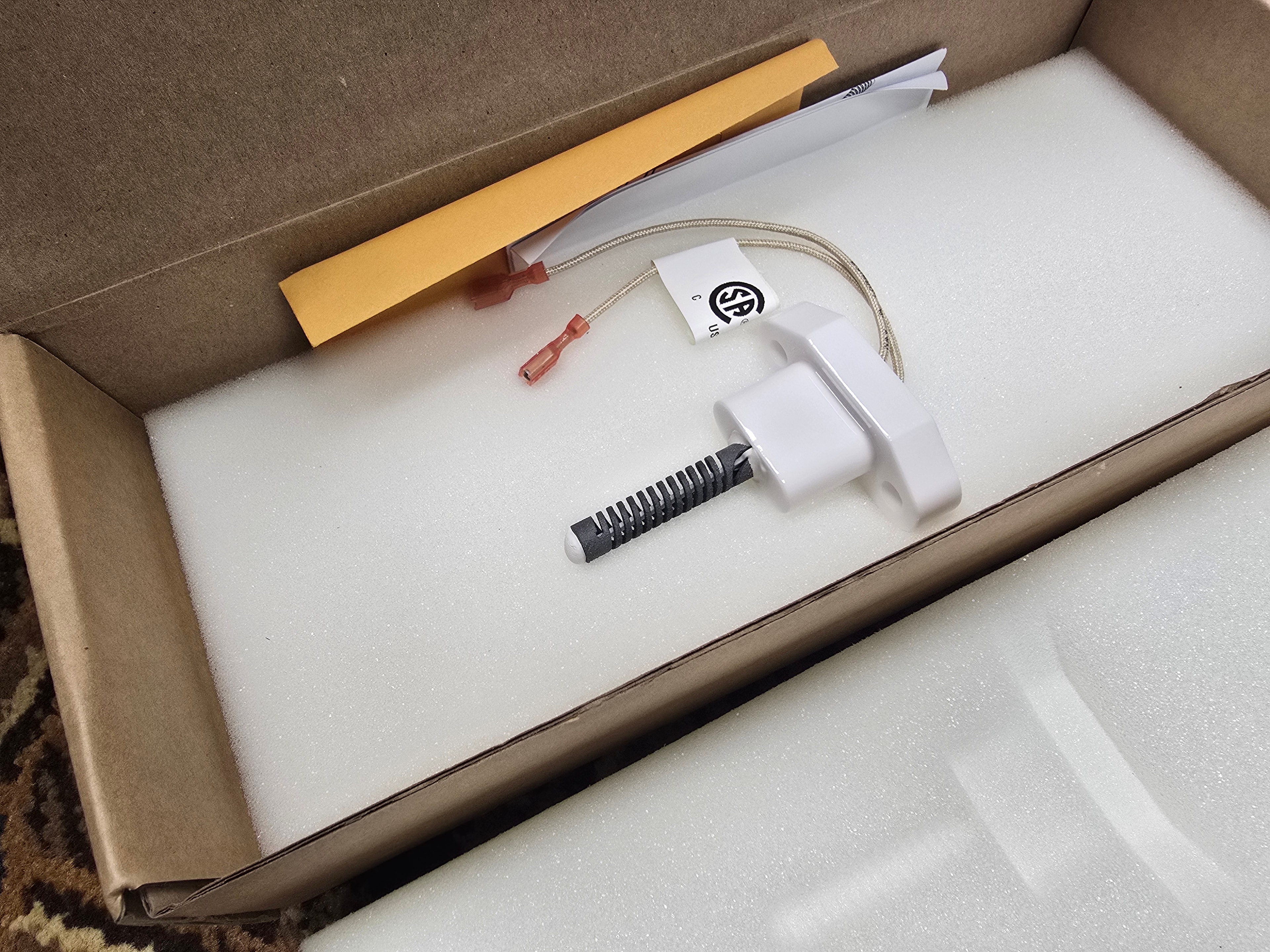 Zodiac Jandy R0457502 JXi igniter kit contents — ignitor element, mounting hardware, wire connector, instruction sheet